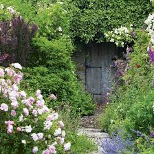 Take A Tour Around A Beautiful English Country Garden Ideal Home Country Garden Design Secret Garden Door English Garden Design