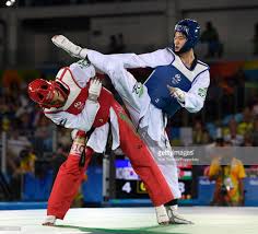 Daehoon Lee Of Korea Competes Against Ahmad Abughaush Red Of Jordan During Their 68kg Quarterfinal Taekwondo Contest At T Taekwondo Taekwondo Girl Ufc Boxing