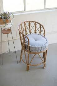 What A Duo This Stylish Bamboo Chair Paired With This Blue Ticking Cushion Makes A Wonderful Backyard Patio Addition Yo Bamboo Chair Chair White Wicker Chair
