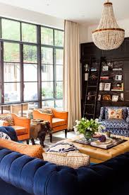 29 Stunning Living Rooms For Every Type Of Style Living Room Orange Blue And Orange Living Room Blue Living Room Color