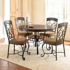 Bring The Romantic Look Of Wrought Iron To The Table With The Greco Dining Collection Fea Wrought Iron Dining Table Round Dining Table Sets Dining Table Black