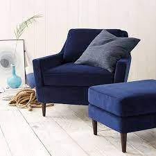 Find patio ottomans in styles and colors that match any outdoor chair. Navy Blue Chair And Ottoman In Cottage Style Interior Dark Blue Cobalt Blue Indigo Blue Royal Blue Nav Upholstered Chairs Living Room Chairs Blue Armchair