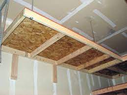 Cut two short pieces of vinyl downspout (5 long or so). Lovely Garage Overhead Storage Diy 11 Diy Overhead Garage Storage Shelves Diy Overhead Garage Storage Garage Ceiling Storage Overhead Garage Storage