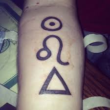 The Husband S Leo Tattoo The Circle Is The Sun His Ruling Planet Then The Leo Sign Then This Symbol For F Leo Tattoos Leo Tattoo Designs Leo Zodiac Tattoos