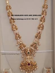 New Designs Of Haaram And Necklaces In Nakshi Work With Rubi Emeralds A Bridal Gold Jewellery Bridal Gold Jewellery Designs Gold Necklace Indian Bridal Jewelry