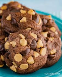 Chocolate Peanut Butter Chip Cookies Piled On A Blue Plate Healthy Food Pa In 2020 Peanut Butter Chip Cookies Peanut Butter Chocolate Chip Cookies Peanut Butter Chips
