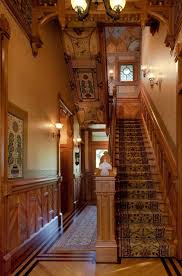 Heavy Dark Woods And Rich Colors Create A Stunning Hallway And Staircase In This Victorian Home Staircase Design Victorian Homes Architecture