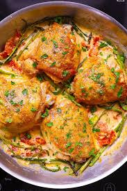 Chicken Thighs With Creamy Asparagus Sun Dried Tomato Sauce Sun Dried Tomato Sauce Chicken Dinner Chicken Thighs
