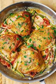 Chicken Thighs With Creamy Asparagus Sun Dried Tomato Sauce Weeknight Dinner Recipes Easy Recipes Chicken Recipes