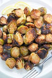 Lemon And Garlic Roasted Brussels Sprouts Baker By Nature Recipe Sprout Recipes Brussels Sprouts Recipe Roasted Brussel Sprouts