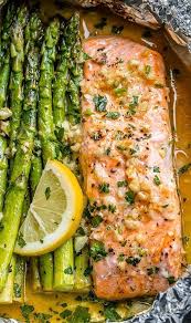 Salmon And Asparagus Foil Packs With Garlic Lemon Butter Sauce In 2020 Baked Salmon And Asparagus Salmon And Asparagus Delicious Salmon Recipes