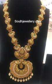 22 Carat Gold Antique Finish Peacock Lakshmi Haram Adorned With Polki Diamonds Rubi Bridal Gold Jewellery Gold Jewellery Design Necklaces Gold Jewelry Fashion