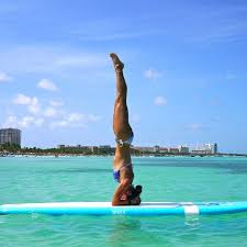 8 Hotels That Offer One Of A Kind Local Experiences Paddle Board Yoga Yoga Girl Paddle Boarding