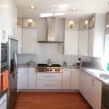 white slab cabinets with aluminum glass