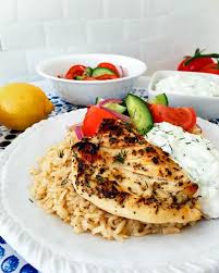 Simple Greek Grilled Chicken Rice Bowl Served With A Fresh And Vibrant Salad And Delicious Tzatziki March Chicken Rice Bowls Baked Greek Chicken Greek Chicken