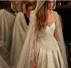 The Gown S A Little Odd But I Like The Cape Veil How Amazing Is This Cape Like A Game Of Thrones Theme Bridal Gowns Beautiful Dresses Medieval Wedding