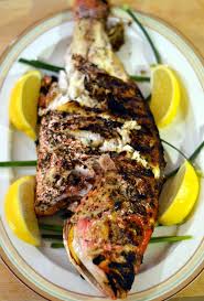 Grilled Whole Red Snapper With Lemon Garlic And Herbs Whole Snapper Recipes Whole Fish Recipes Grilled Fish Recipes