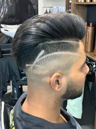 500 Haircut Pictures Download Free Images On Unsplash The hair is cut short around the sides and back of the head while the top remains long.