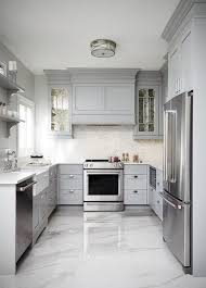 this gray u shaped kitchen features a