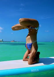 Lotus Headstand On A Paddle Board Paddle Board Yoga Yoga Inversions Yoga Poses