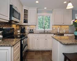 kitchen cabinets with black appliances
