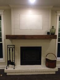 Painted Brick Wood Mantel And Shiplap Minus The Hid A Tv Grandmothers Mirror Will Look Much B White Brick Fireplace Freestanding Fireplace Fireplace Remodel