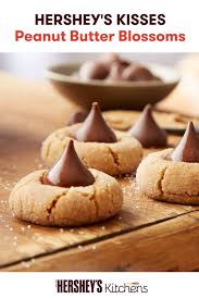 Looking For A Recipe That You Can Make With The Entire Family Look No Further Than This Kisses Peanut Butter Blo Peanut Butter Blossoms Recipe Desserts Baking