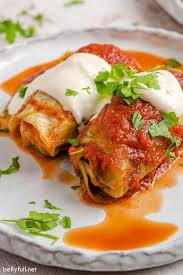 This Stuffed Cabbage Rolls Recipe Is Tender Cabbage Leaves Filled With Lean Ground Beef And Rice And Cabbage Rolls Cabbage Rolls Recipe Homemade Tomato Sauce