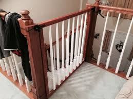 Diy Baby Gate Took Some Home Depot Lumber 2x2 Some Spare Bannister Spindles Some Wood Stain White Paint Hinges Diy Baby Gate Baby Gates Diy Baby Stuff