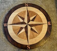Diy Compass Table Made From Wooden Floor Panels Compass Wall Decor Cool Wood Projects Cool Woodworking Projects