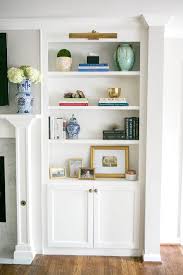 An Updated Fireplace House Of Harper Bookshelves In Living Room Built In Shelves Living Room Living Room Decor Modern