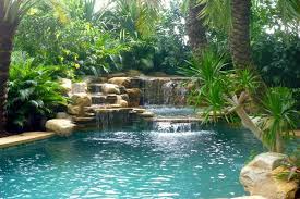 Waterfall And Tropical Garden Tropicale Piscina Miami Di Matthew Giampietro Garden Design Pool Waterfall Tropical Pool Pool Landscaping