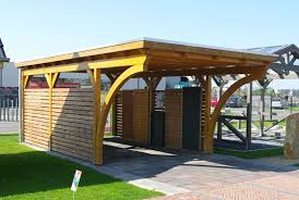 Ein Carport Mit Rundbogen Aus Leimholz Dieser Flachdachcarport Hat Einen Individuellen Charme Durch Die Runden Bogen An Der Carport Carport Holz Garten Design