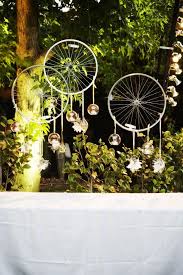 Bike Rims With Hanging Tea Lights Party Decorations Backdrop Root 75 Flowers Home Coronado Ca Diy Garden Decor Garden Tools Decor Garden Art