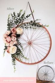 Repurpose And Recycle An Old Bike Wheel Turn A Bike Wheel Into A Floral Wreath By Using Some Spray Paint And Some Faux Bike Decorations Wheel Decor Bike Wheel