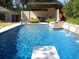 Swiming Pools Swimming Pool Discounter Design With Relaxing Outdoor Sofas Also Water Fall Jets And Diving B Piscine Et Jardin Piscines Design Piscines Modernes