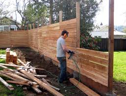 I Want The Slats Of Our Horizontal Fence To Be A Little More Delicate Than This But The Wide Treated One At The Bot Backyard Fences Backyard Diy Privacy Fence