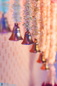 Wedding Bells White Traditional Floral Strings With A Mini Ghanti Decor Indianweddings Wedding Stage Decorations Wedding Decor Elegant Stage Decorations