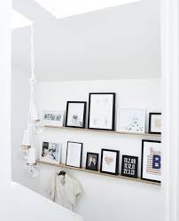 Frames On A Picture Ledge Studio Apt Scandinavian Interior Living Room Interior Kitchen Decor