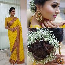 The traditional indian saree has gorgeous colors and designs and you have to wear it with a proper hairdo. Saree And Hair Bun Indian Wedding Hairstyles Indian Hairstyles Hair Style On Saree
