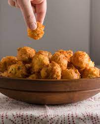 Hush puppies are little balls of fried cornbread flecked with onions. Cheddar Hush Puppies Gluten Free