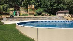 Radiant 24 Semi Inground Round Built Into A Hill Backyard Pool Radiant Pools Pool Landscaping