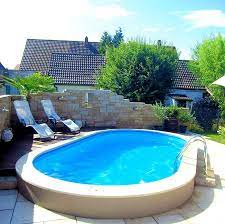 We Have Got All The Above Ground Pool Supplies And Ideas You Re After Here To Help Make Your Pool Fun And Low Mainte Oval Pool In Ground Pools Pool Landscaping