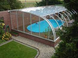 Swimming Pool And Green House In One Great Way To Maximize Space And Provide Shelter For Tropical Plant Swimming Pool Landscaping Pool Landscaping Pool Houses