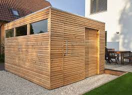 Design Gartenhaus Mit Larchenholz Und Schiebetur Als Flachdach Mit Kubusform Und Lichtausschnitt Uber Alle Shed Homes Flat Roof Shed Garden Design