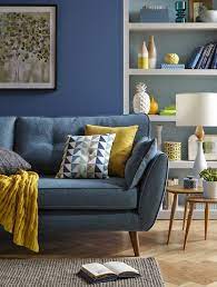 According To American Home Furnishings Alliance Consumer Research Most Americans Have At Least O Blue Sofas Living Room Yellow Living Room Modern Sofa Designs
