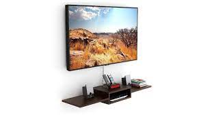 Living room inspiration for a large contemporary enclosed living room in surrey with grey walls, carpet, a hanging fireplace, a wooden fireplace surround, a wall mounted tv and grey floors. Tv Unit Wall Mounted Tv Unit Designs To Incorporate In Living Room Most Searched Products Times Of India