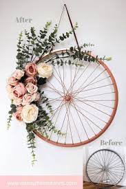 Repurpose And Recycle An Old Bike Wheel Turn A Bike Wheel Into A Floral Wreath By Using Some Spray Paint And Some Faux Bike Decorations Wheel Decor Bike Wheel