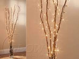 Using Decorative Twigs And Twirling Fairy Lights Round Creates A Nice Effect Would Look Good In A Woodlan Scene Decor Twig Fairy Lights