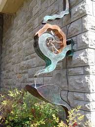 Creative Downspouts Are Excellent House Exterior Decorations That Make A Statement And Give A Building Unique Character A Rain Chain Garden Art Garden Projects